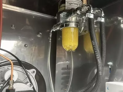 Tiger Loop fuel system installed with new fuel feed on a Nilfisk 400HS DTE pressure washer. Removes air from the fuel line, stabilises fuel delivery, and improves burner efficiency and reliability.